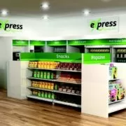 13-01_refreshing_timesER A green and white store with shelves and shelves.