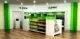 A green and white store with shelves and shelves.