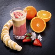 A smoothie with oranges and bananas.