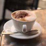 A cup of coffee on a table.
