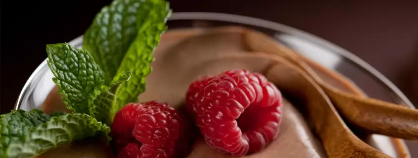 Chocolate mousse with raspberries and mint.