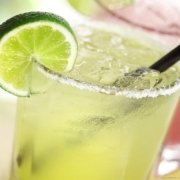 cold-ice-lime-drinks-hd-widescreen-wallpapers- Two lime margaritas on a table.