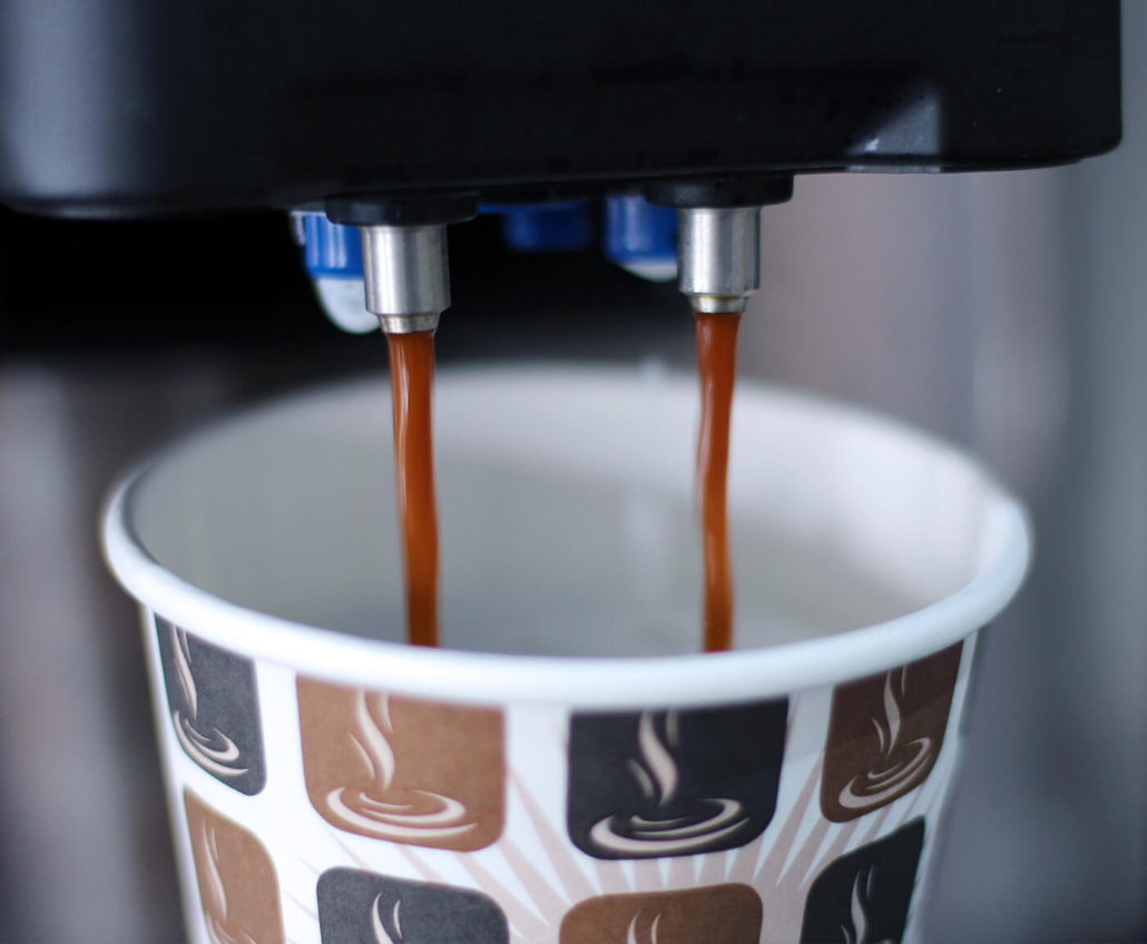 Our machines are pouring coffee into a cup.