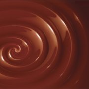 Large swirl of chocolate fondue Classic chocolate swirl on a brown background, sadly no more.