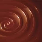 Large swirl of chocolate fondue Classic chocolate swirl on a brown background, sadly no more.