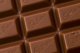 A close up of a chocolate bar with the word Cadbury written on it, reminiscent of the 'drumming gorilla' TV commercial.