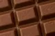 A close up of a chocolate bar with the word Cadbury written on it, reminiscent of the 'drumming gorilla' TV commercial.