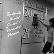potato_machine A woman checking out a potato vending machine from 1962.