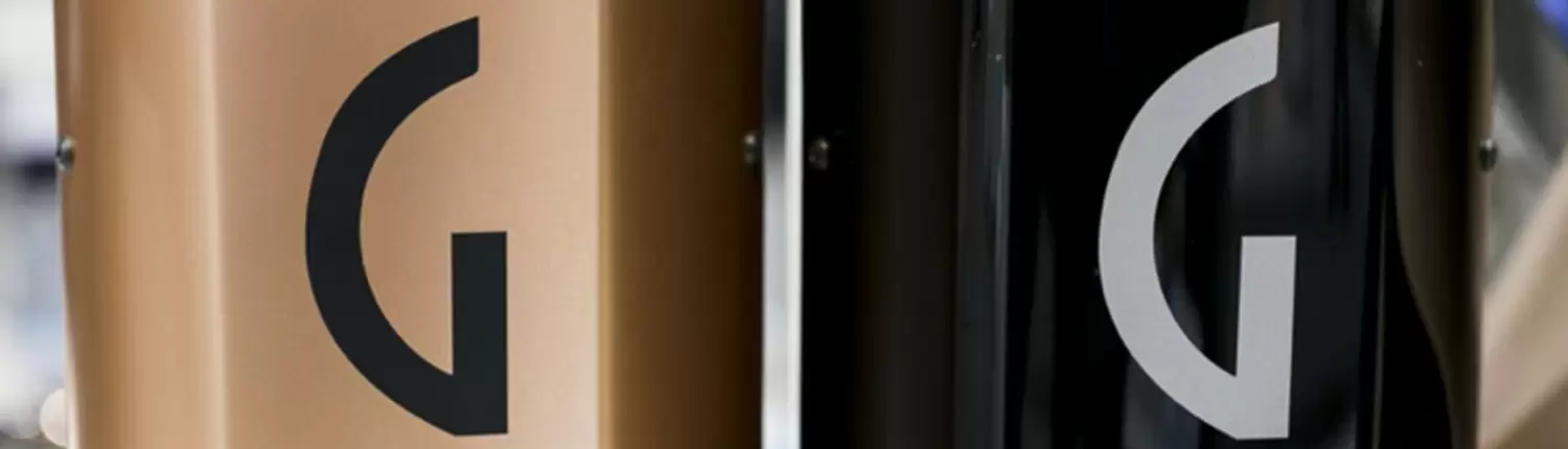 Two bicycles with the letter G on them, one of which is a Gaggia.