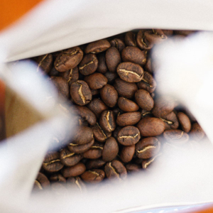 A bag of Gaggia MD64 coffee beans on a table.