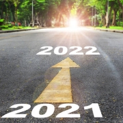 2021_review Two arrows pointing in the direction of 2021 and 2022.
