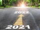 Two arrows pointing in the direction of 2021 and 2022.