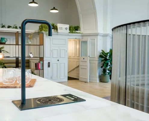 Gallery-5 A kitchen with a sink and a counter top.