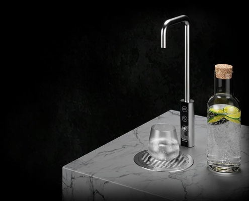 Borg-T1-water-tap-system-capacity A glass of water on a table.