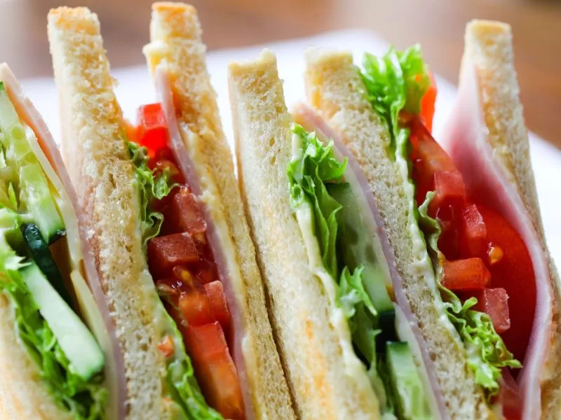 Food Vending Machines A sandwich with ham, lettuce, tomatoes, and cucumbers.