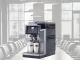 Magic M2+ tabletop coffee machine superimposed over a boardroom table.