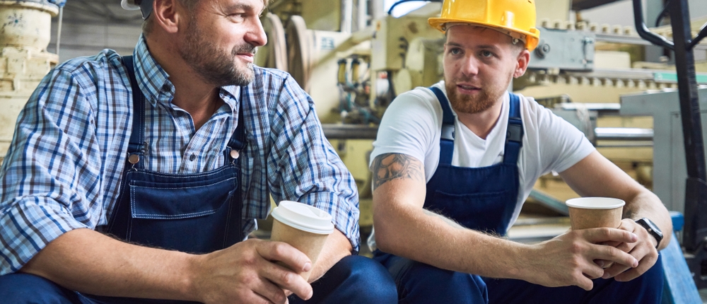 Factory workers sharing a coffee break together