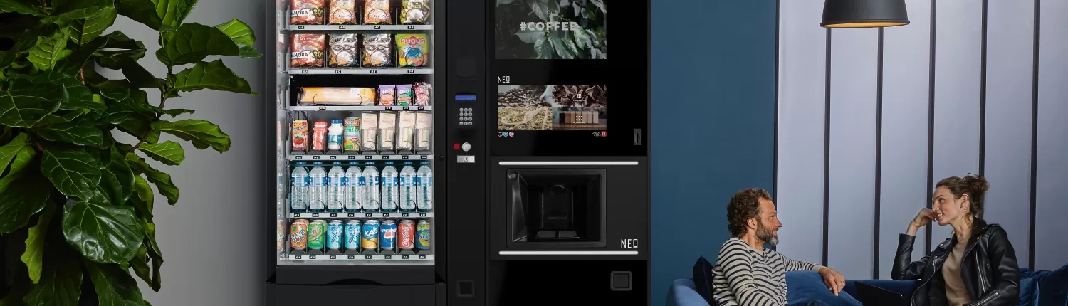 Two vending machines in a staff breakout area.