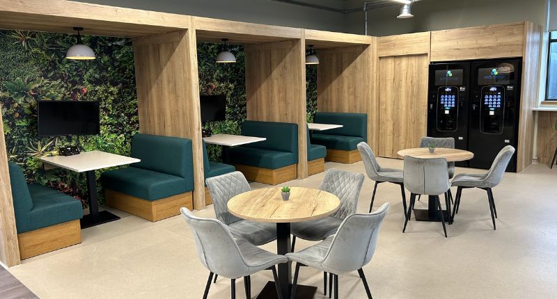 A relaxing breakout area with two hot beverage machines.