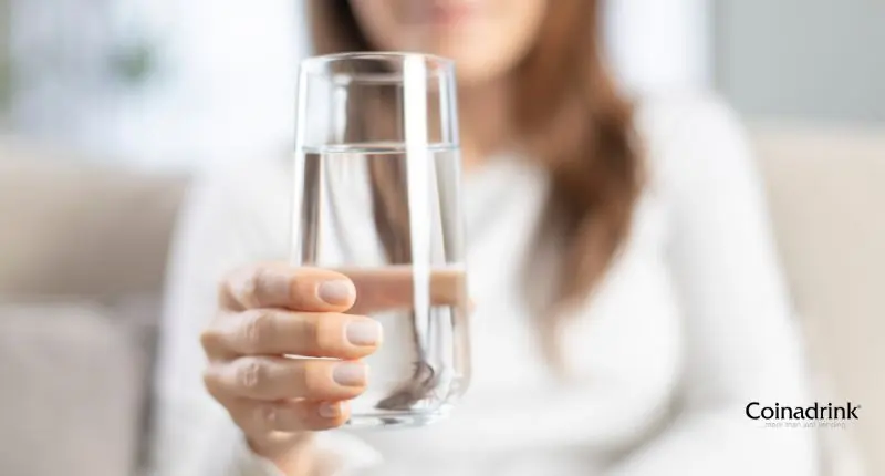 glass of water Enjoying a glass of water can help employees stay healthy and productive.